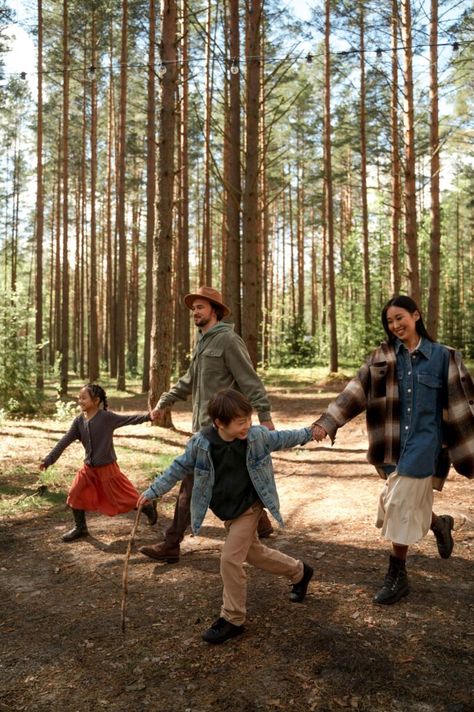 family that goes for a regular walk in the forest with their kids
