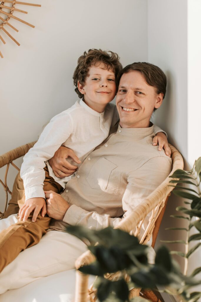 father is proudly showing off his responsible child